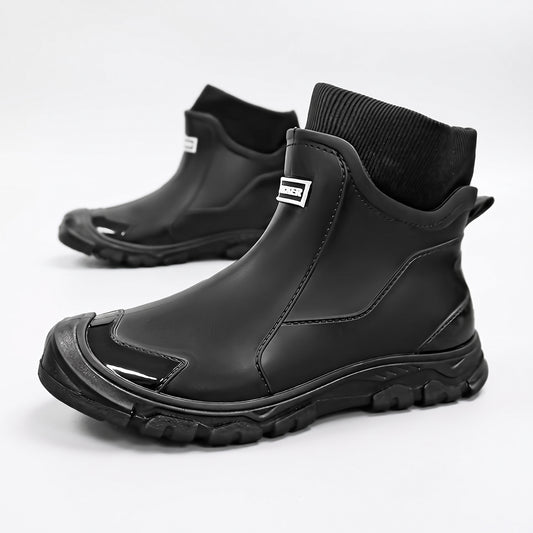 Short rain boots for women and men in black - pair on a white background