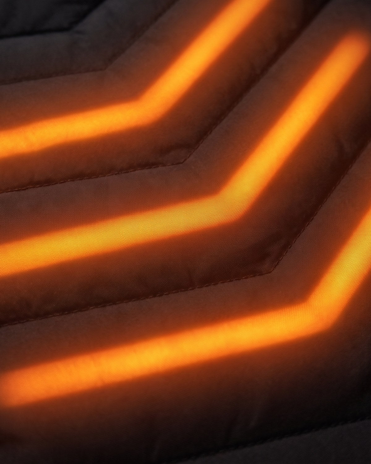 Flat graphene panels, warm across their whole surface — not a wire and a hope.