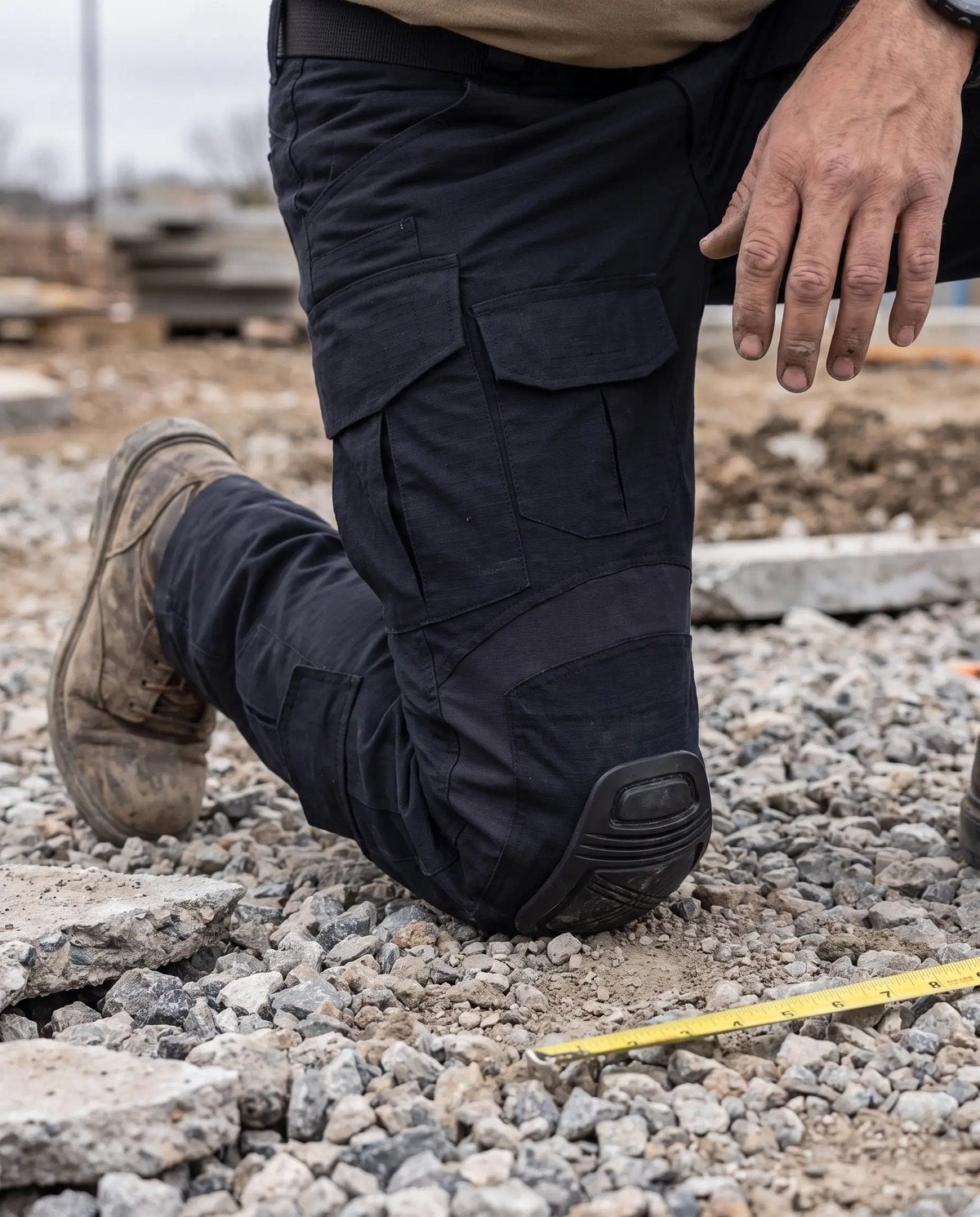 Gravel, broken concrete, wet ground: ripstop and a double-layer knee take it, not your kneecap.